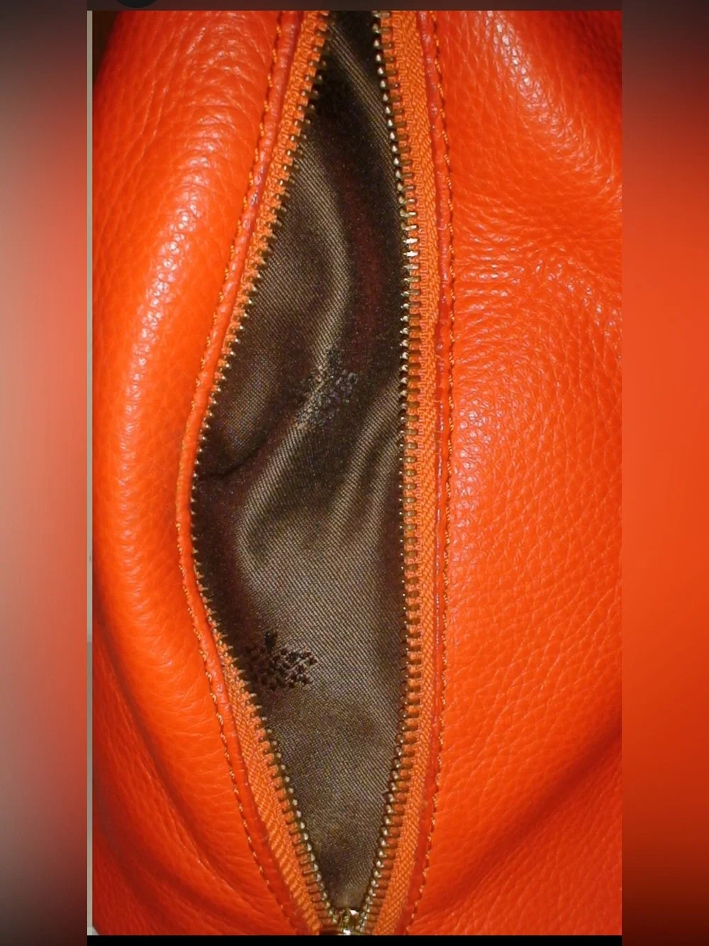 Mulberry Orange Leather Hobo Bag with Tassels and Gold Emblem